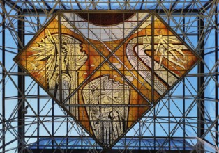 Stained glass artwork entitled Icarus, one of two glass artworks by Leifur Breidfjörd at Keflavik