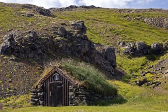 Grass-covered house in the landscape at Gudrúnarlaug, Búardalur, West Iceland, Iceland