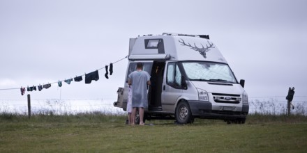 Campervan with clothesline at the campsite in Reykjadiskur at Skagafjördur, Iceland