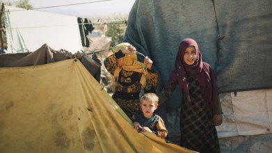 Syrian children playing in a refugee camp near the Turkish border on World Children's Day. Aleppo,