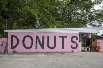 Sawyer, Michigan - A sign on a store along Red Arrow Highway advertises donuts for sale