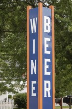 Sawyer, Michigan - A sign at a store along Red Arrow Highway advertises wine and beer for sale