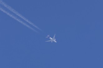 Airbus A300-600RF jet aircraft of FedEx Express airlines in flight with vapour trails or contrails