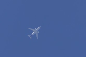 Airbus A300-600RF jet aircraft of FedEx Express airlines in flight in a blue sky, England, United