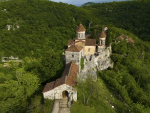 Monastery complex on a hill surrounded by a dense forest, aerial view, Motsameta Monastery, near