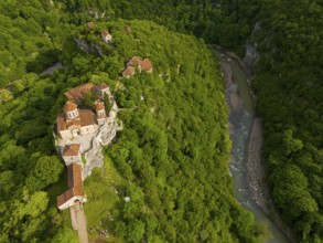 Aerial view of a monastery on a river, embedded in lush nature, aerial view, Motsameta Monastery,