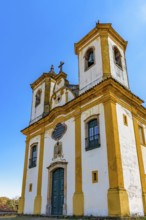 Facade of a baroque church with its towers and crucifix in Ouro Preto, Minas Gerais, Ouro Preto,