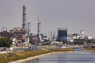 BASF in Ludwigshafen with Rhine and cargo ship. Ludwigshafen, Rhineland-Palatinate, Germany