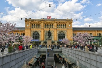 Hanover central station in neo-renaissance style, Ernst August Platz, cherry blossom,