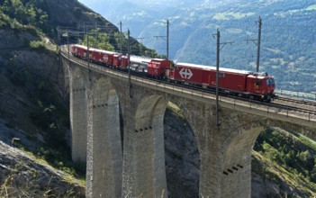 Goods train of the Swiss railway company SBB crosses the Luogelkin Viaduct on the Lötschberg south