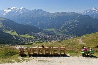 View from the Col de la Croix de Cœur pass to the village of Verbier and the glaciated mountain