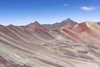 Vinicunca, colourful mountains in the background, in the Peruvian Andes, Cusipata district, Cusco,