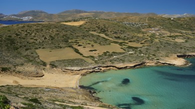 Bay of Vai, coastal landscape with turquoise water and overgrown hills under a clear sky, Analipsi,