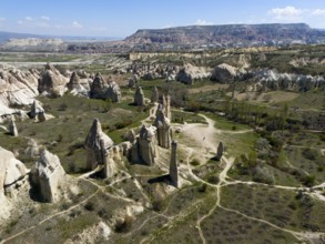 Wide valleys and impressive rock formations stretch out in Cappadocia, aerial view, Love Valley,
