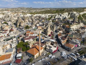 Detailed urban scene with buildings surrounded by unique rock formations in the heart of