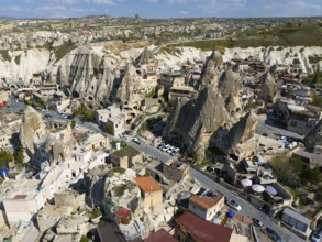 Lively city with unique architecture nestled between striking rock formations, aerial view, Göreme,