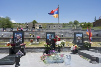 Graves with portraits and flowers in front of the Armenian flag, memorial, graves of 2020, victims