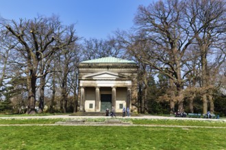 Guelph mausoleum, walkers in the Berggarten, early spring in the Herrenhausen Gardens, sunny