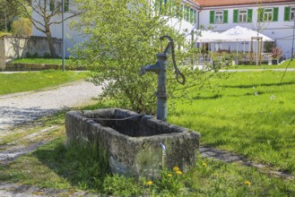 Fountain, stone basin with hand pump, water dispenser, behind Gestütsgasthof, near the