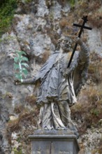 Sculpture of St Nepomuk in front of a rock face, Weltenburg, district of Kelheim, Lower Bavaria,