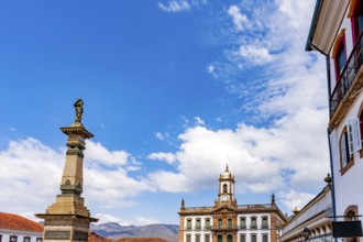 Historic facades and a statue of Tiradentes in the central square of the historic city of Ouro