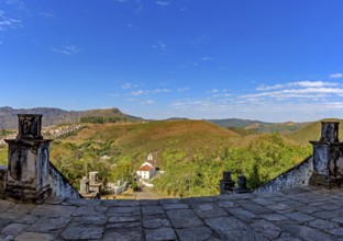 Old stone buildings and a church on the hills of the city of Ouro Preto in Minas Gerais, Ouro