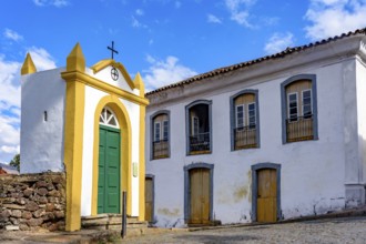 Small chapel and historic mansion on the streets of the city of Ouro Preto in, Ouro Preto, Minas