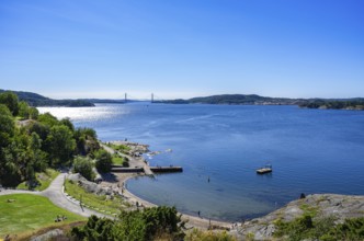 View over the beach promenade to the Byfjord with the Uddevallabron (Uddevalla Bridge) in the