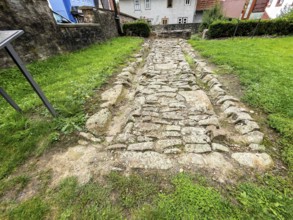 Archaeological find of original small section with old stones from historic trade route between
