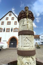 Fairy tale fountain with in the centre stone relief half relief above motif column small tower with