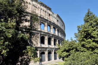 Partially restored façade of the exterior façade of the Roman Colosseum from antiquity, west side,