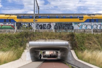 Cycle path in the north of Nijmegen, subway of the railway line, wide cycle path, Netherlands