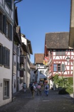 Old town alley with historic half-timbered houses with tourists, Stein am Rhein, Canton