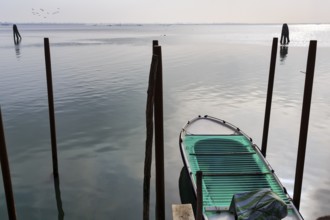 Boat, jetty on the lagoon, Burano, Venice, Veneto, Italy