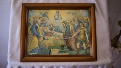 Biblical icon in a wooden frame shows a religious scene with disciples and saints, hand separation,