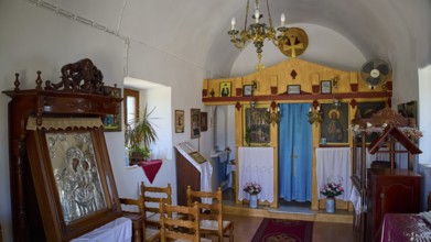 Cosy sacred interior with Orthodox icons and ornate wooden altar, Panagia tou Paleokastro, Church