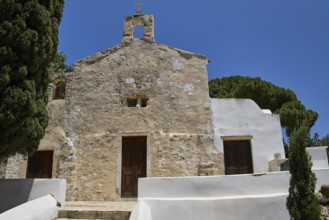 Stone church façade with steeple, simple and rustic architecture, basilica, church, Agios