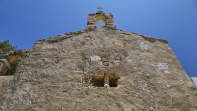 Detail of a stone church façade with architectural elements and steeple, Basilica, Church, Agios