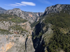 View of an extensive canyon landscape with rugged rocks and lush greenery, aerial view, Saklikent