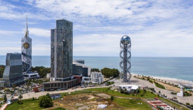 Modern skyline of a city on the coast with impressive skyscrapers and sea view, aerial view, Batumi