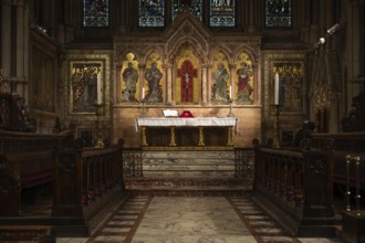 Detailed church altar surrounded by candles, St Mary Abbot Church, Kensington, London, England,
