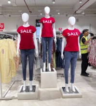 Mannequins display SALE at Zudio clothing store in Guwahati, India, as shoppers browse discounted