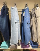 Jeans display at Zudio store in Guwahati, India, during a monsoon season sale on August 1, 2025