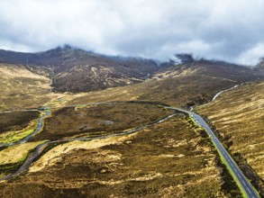 Eas a' Bhradain Waterfall from drone, Red Cuillin mountains, Loch Ainort, Isle of Skye, Scotland,