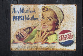 Retro Pepsi advertising sign with smiling woman and nostalgic design, Ringkøbing, Ringkøbing Fjord,