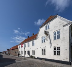 White historic buildings on a cobbled street, Old Town, Ringkøbing, Ringkøbing Fjord, Denmark