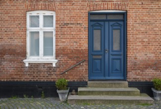 Brick façade with a striking blue door, Old Town, Ringkøbing, Ringkøbing Fjord, Denmark