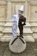 Pierrot, white painted face, conical hat, white clown, figure of the Commedia dell'arte,