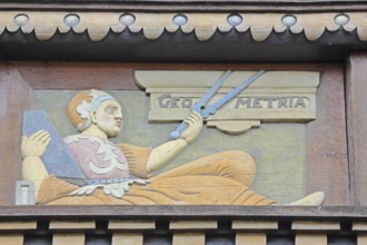 Allegorical woodcarving with figure for geometry with compass, geometric, measured, measurement,