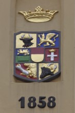 Coat of arms with date on the World Heritage House, built in 1858, former main guard, crown,